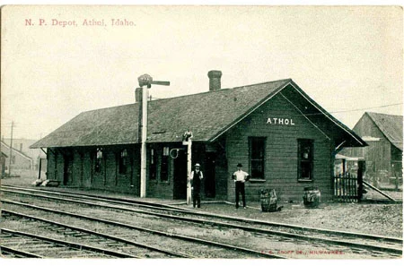 Historic postcard of the Northern Pacific Railroad depot in Athol, Idaho