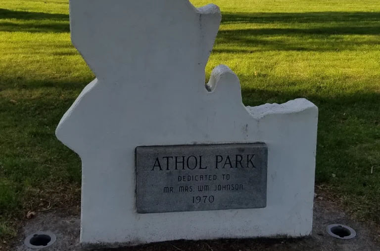 Idaho-shaped stone monument dedicating Athol Park